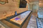 Woodsong -  Shuffleboard in game room 